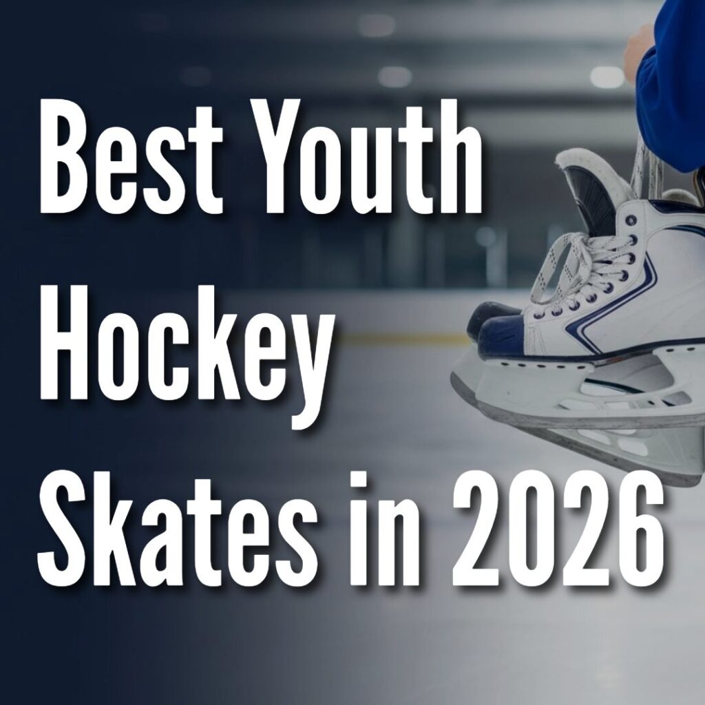 Youth hockey skates in white and navy resting on the ice with a soft navy gradient on the left.